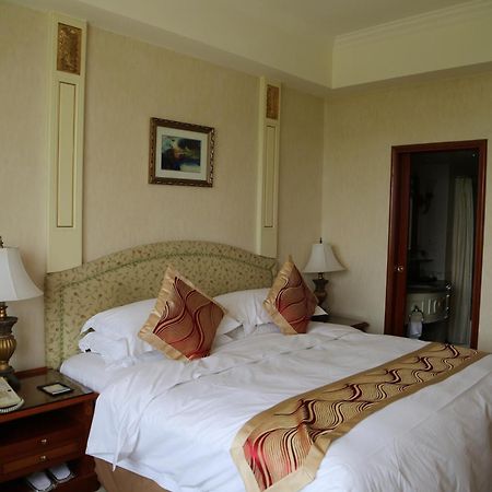 Huiquan Dynasty Hotel Csingtao Szoba fotó